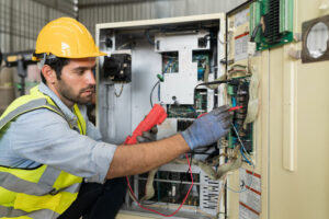 electrician working on panel