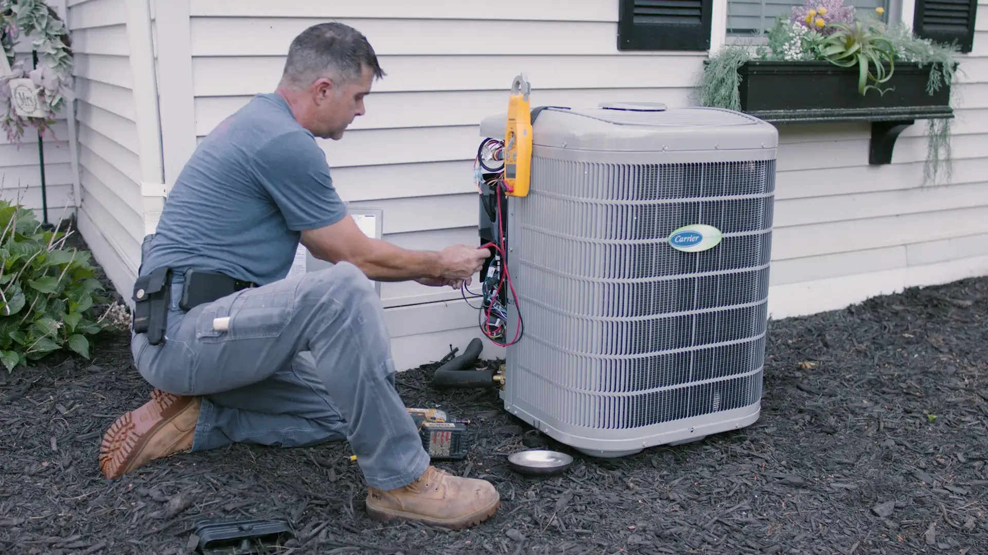 HVAC Tech working on system