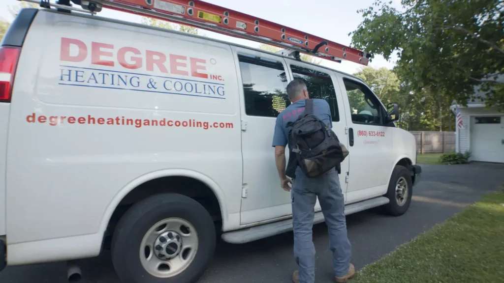 Technician in front of Degree truck