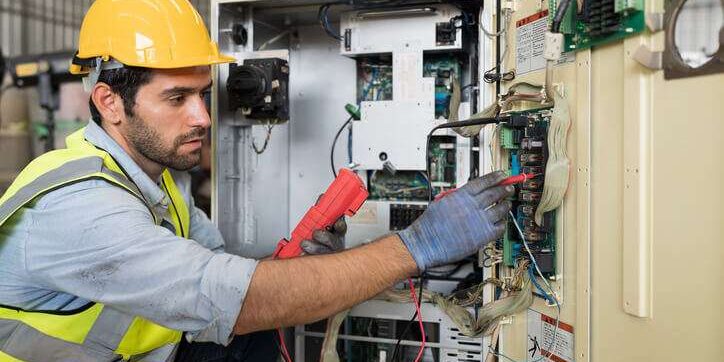 electrician working on panel